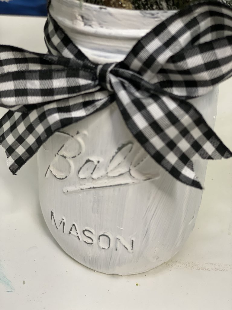 Closeup of Painted Mason Jar with Buffalo Plaid Ribbon