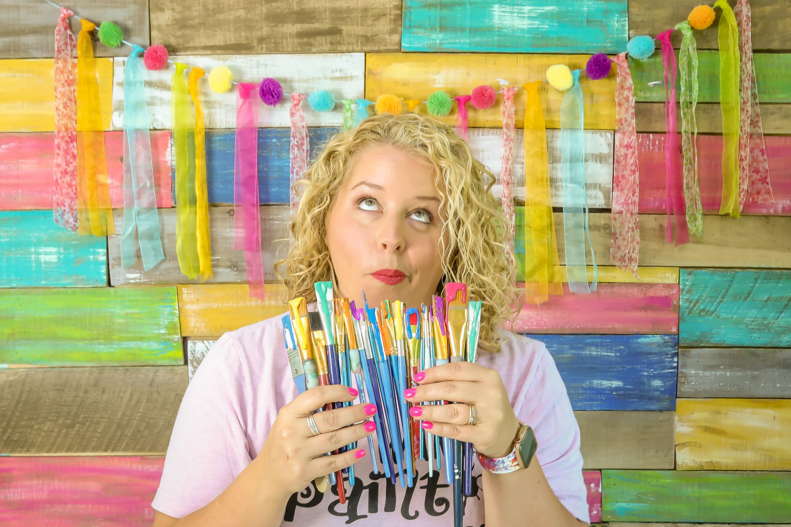 Tamara Bennett Holding Paint Brushes from Southern A-Door-nments
