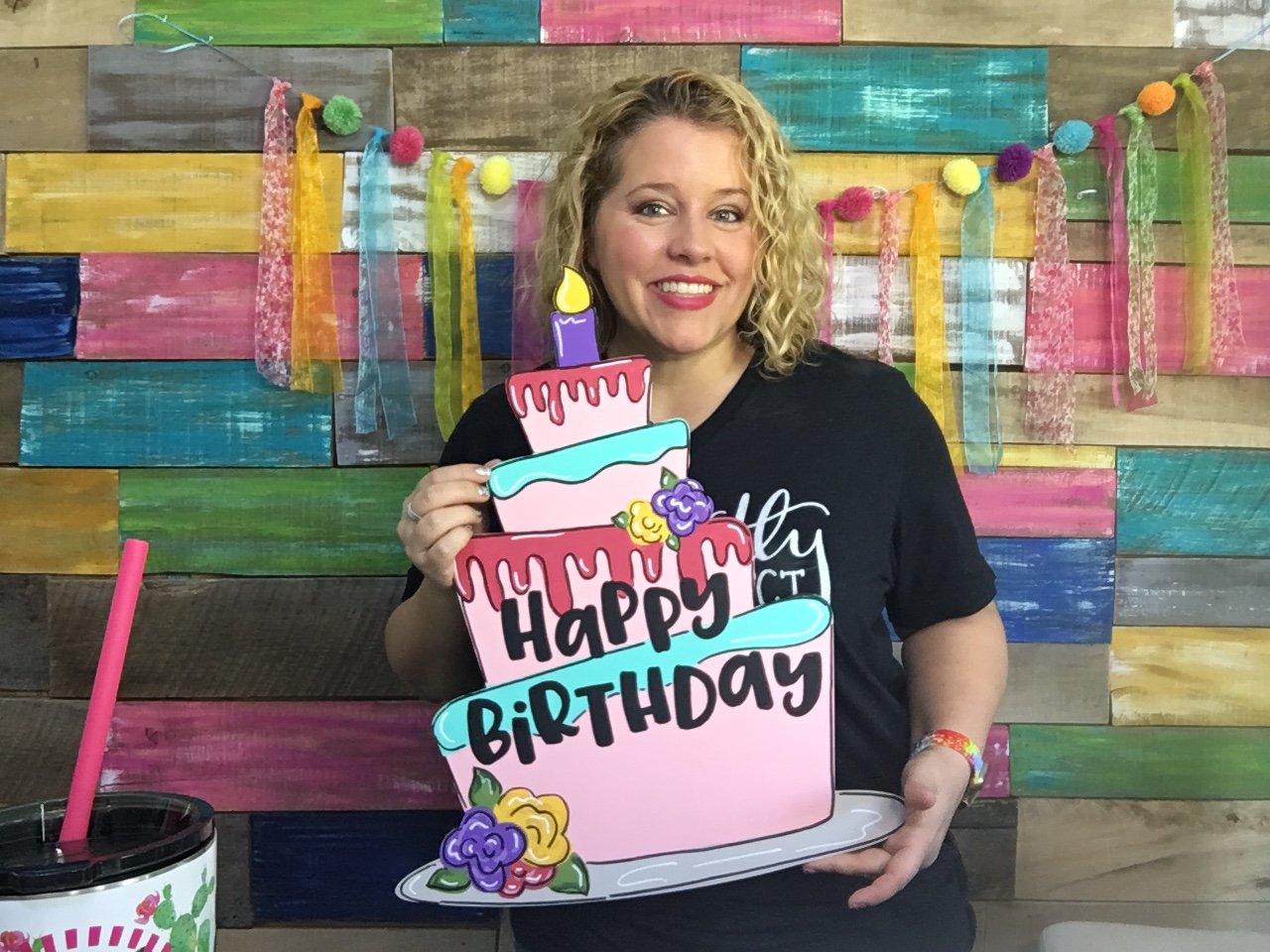 Tamara holding the Happy Birthday Door Hanger