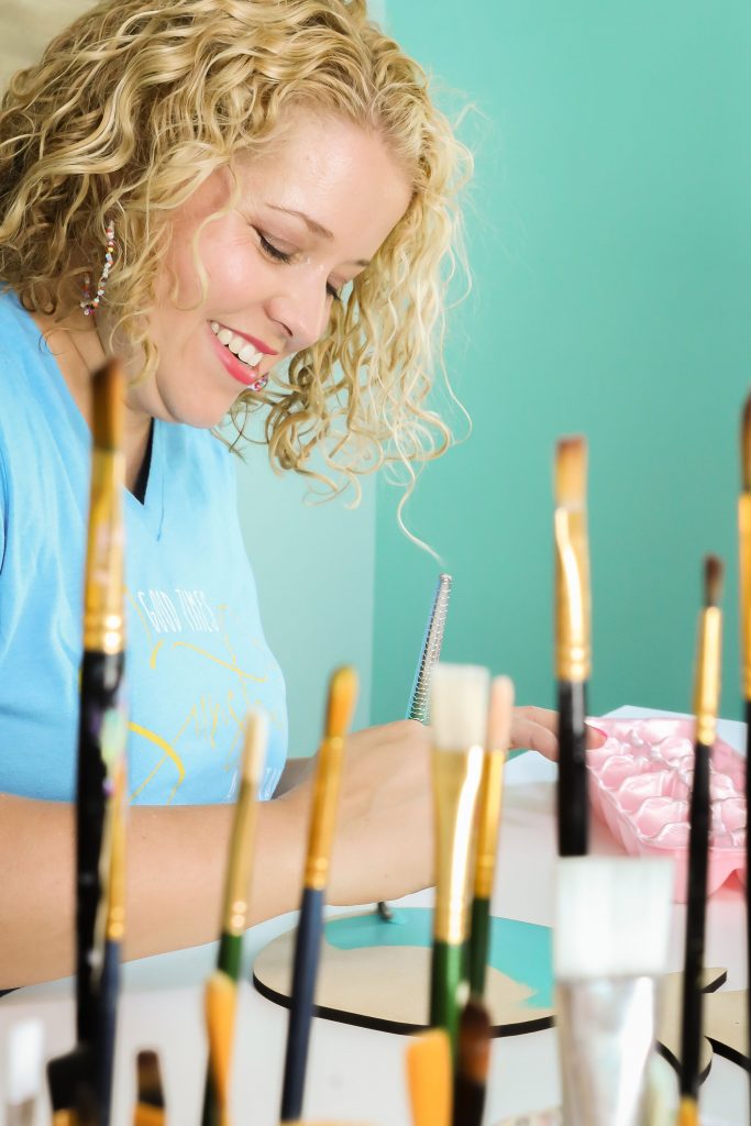 Tamara painting at her desk