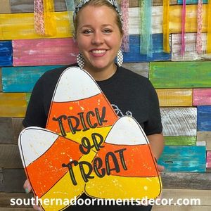 Tamara holding the completed Candy Corn Trio Door Hanger