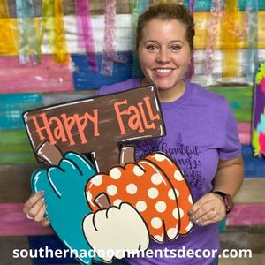 Tamara holding the completed Triple Fall Pumpkins Door Hanger