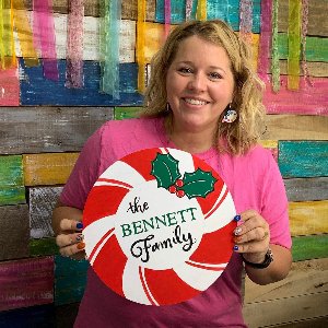 Tamara holding Peppermint Family door hanger