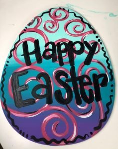 Egg with swirls that reads "Happy Easter"