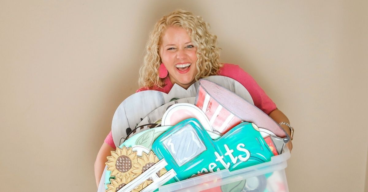 Tamara holding a bunch of door hangers