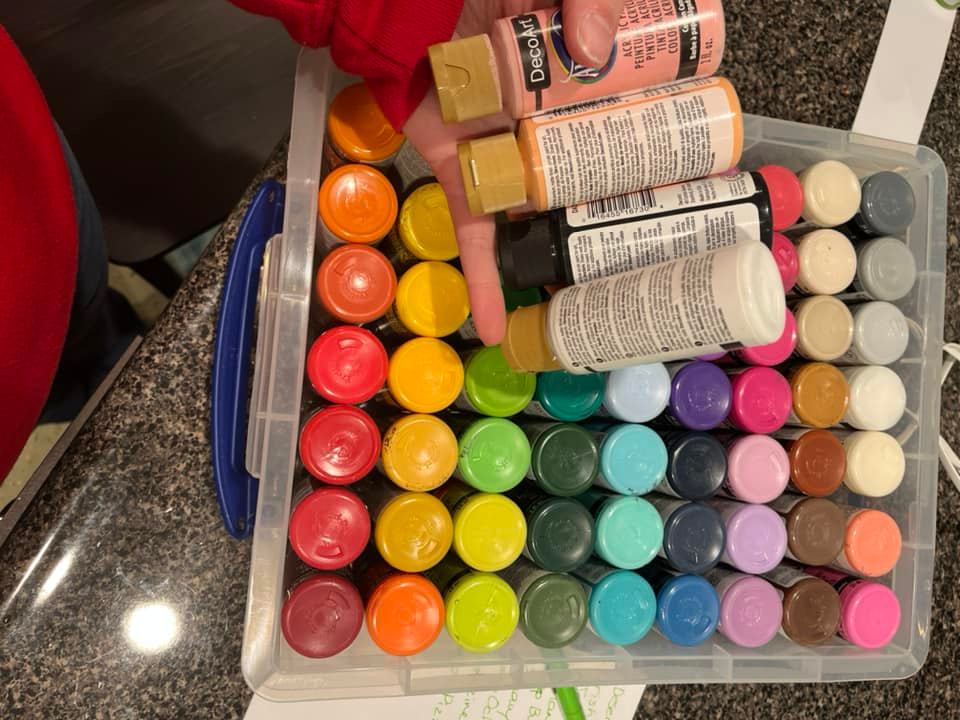paints stored in tote boxes