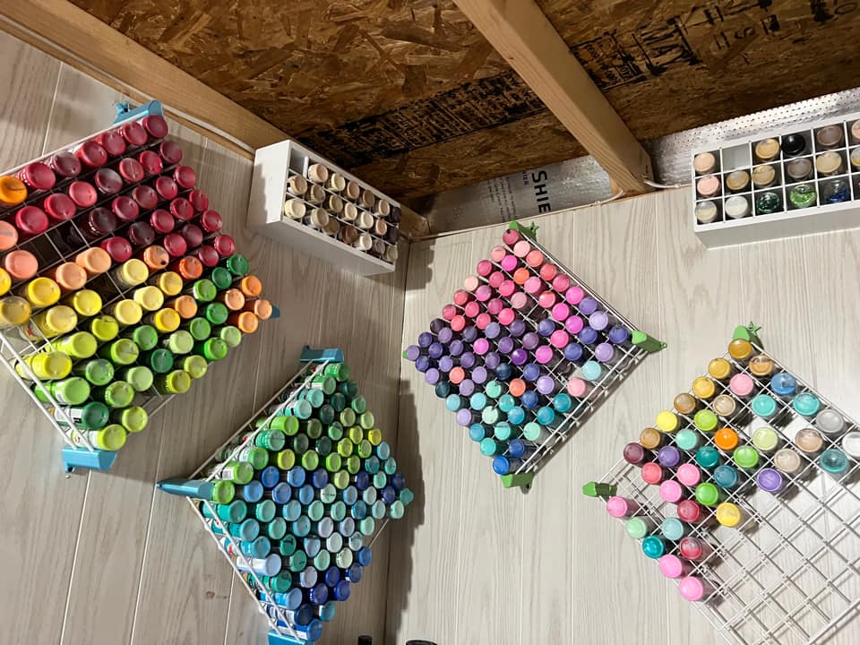 paint storage bottle organizer hanging on wall