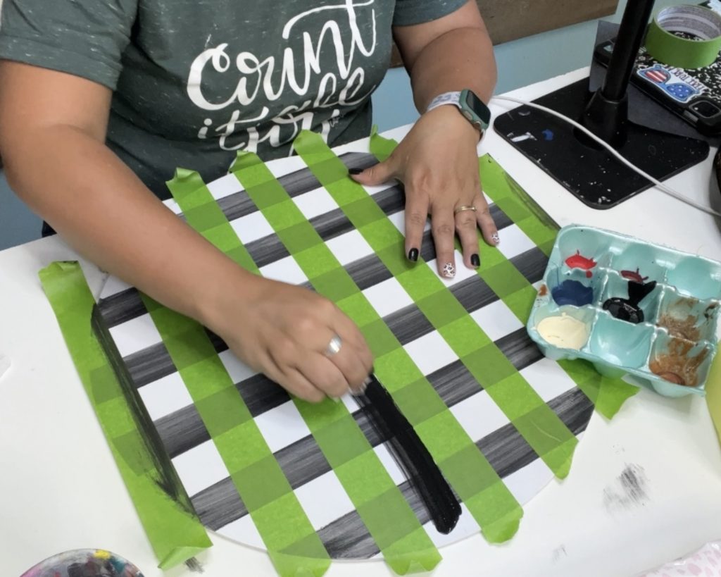 using a baby wipe to paint buffalo plaid