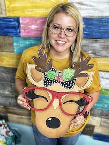 Tamara holding the reindeer with glasses remix