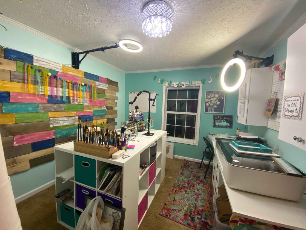 craft room overview with 9 cube desk and pallet wall backdrop