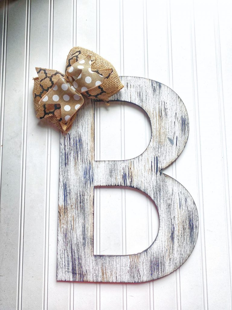 Wooden letter rustic painted with a burlap bow